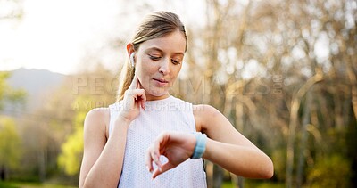 Buy stock photo Girl, smart watch and check pulse in nature for running performance, tracking speed and fitness monitor. Athlete, runner and biometric in forest for wellness progress, heart rate or earphones outdoor