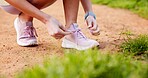 Sports, hands and person tying laces in nature for running, workout or training for marathon. Shoes, outdoor and closeup of athlete preparing for cardio, fitness or endurance exercise in park.