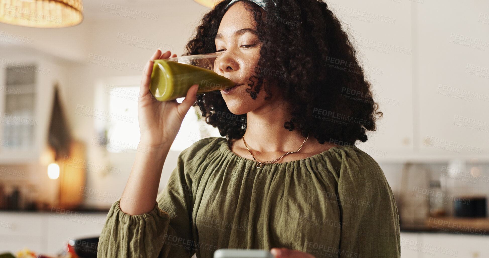 Buy stock photo Woman, home and drinking with green smoothie on glass for health, nutrition and diet. Female person, nutritionist and satisfied at kitchen with juice for supplements, detox and vitamins for wellbeing