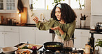 Happy woman, cooking and taste with spoon in kitchen for stir fry, meal prep or flavor at home. Female person, chef and smile with organic ingredients on stove for spices, recipe or results at house