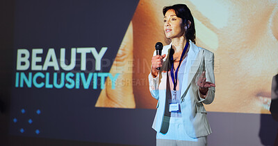 Buy stock photo Woman, presentation and speaker at conference with beauty, inclusivity or stage with mic for skincare. Person, speech and announcement for makeup, cosmetics or information at international convention