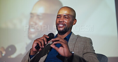 Buy stock photo Event, speaker and black man at seminar with microphone, screen and presentation of business ideas. Speech, presenter and businessman on stage for conference on development, growth and solution