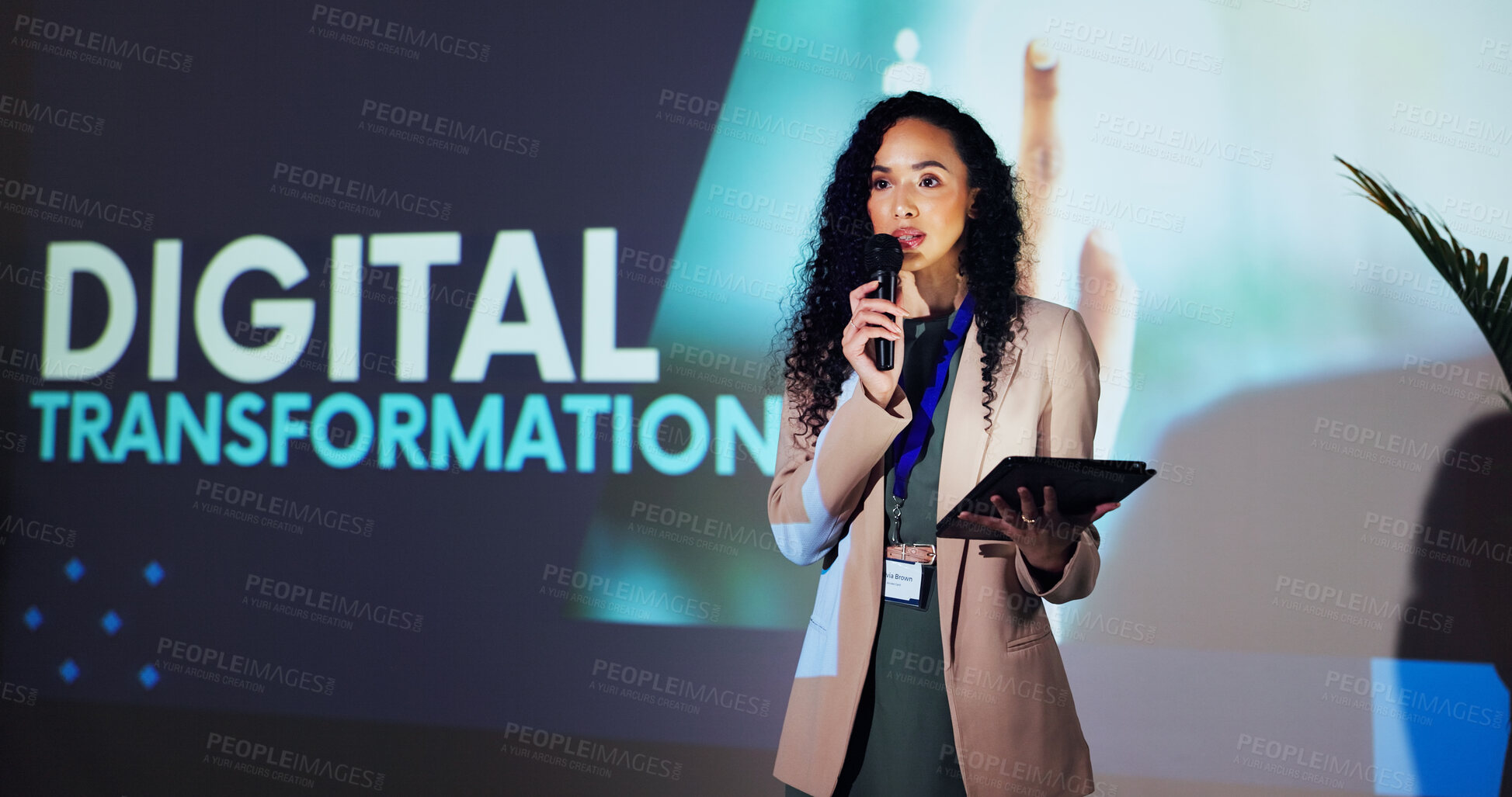 Buy stock photo Stage, speaker and woman at seminar with microphone, tablet and presentation on digital transformation. Ideas, change and presenter at conference on future business development plan with technology