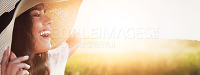 Buy stock photo Shot of an attractive young woman standing outside in a field