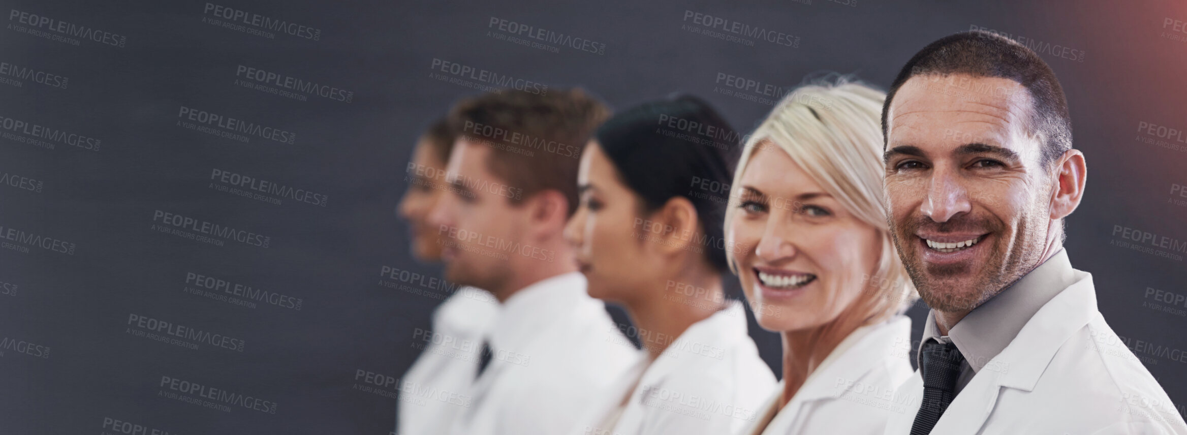 Buy stock photo Smile, row and medical people in studio for healthcare leadership, teamwork and consulting service. Employees, banner and doctor with career ambition, mockup space and opportunity on gray background