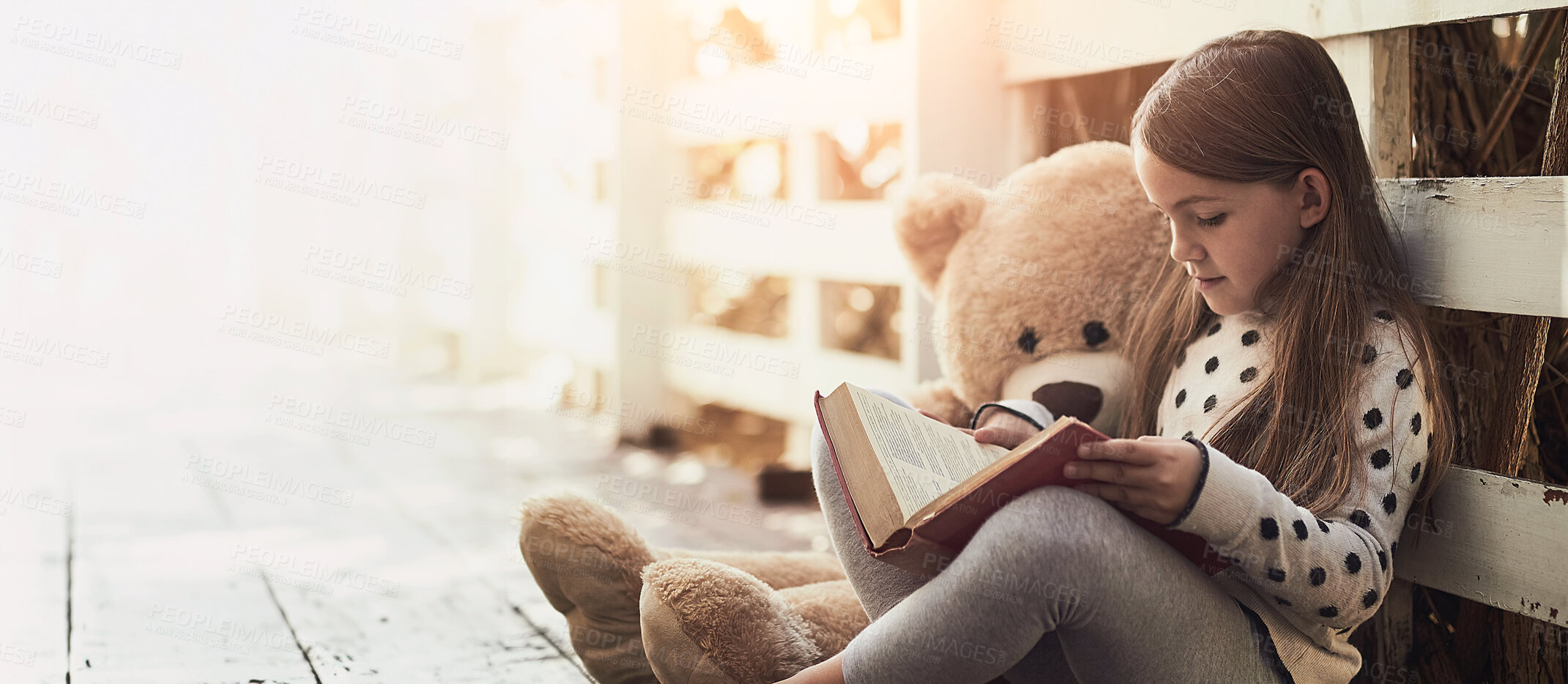 Buy stock photo Outdoor, teddy bear and girl with book for reading, education and language development. Backyard, toys and female child with textbook for storytelling, drawing and entertainment with fantasy