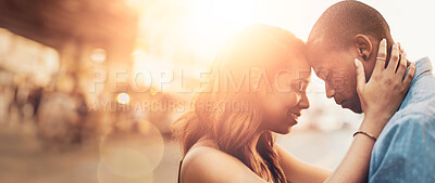 Buy stock photo Shot of an affectionate young couple sharing a tender moment outdoors