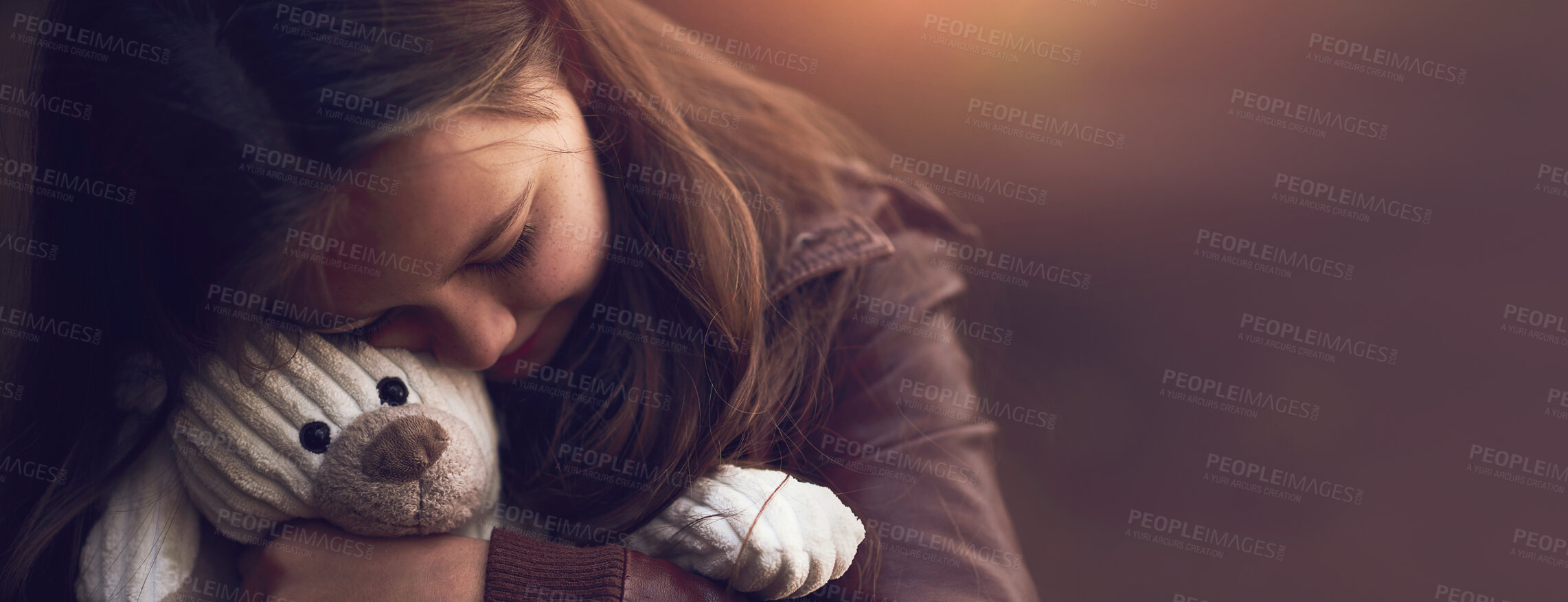 Buy stock photo Cropped shot of a young girl hugging her teddy bear outside