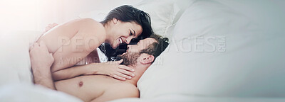 Buy stock photo Shot of a young couple sharing an intimate moment in their bedroom