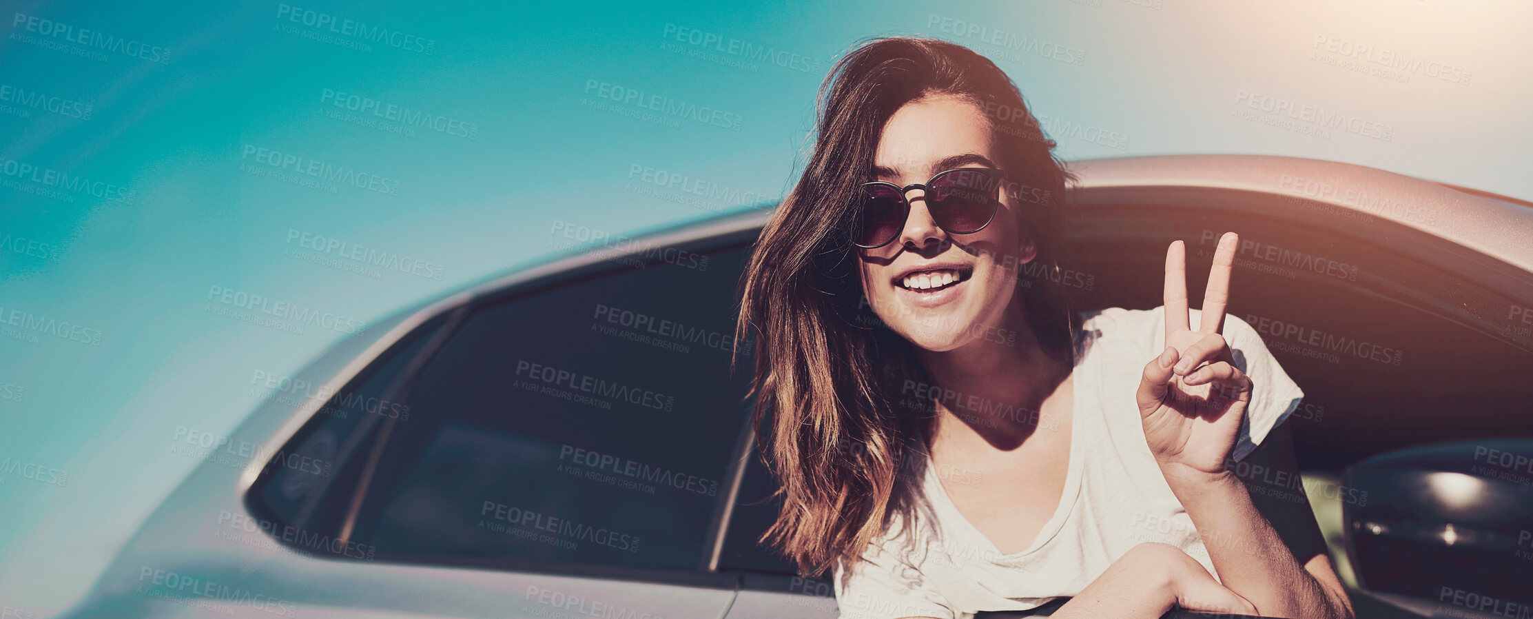 Buy stock photo Woman, sunglasses and peace by car window in summer for travel, freedom and vacation with sunshine. Girl, motor and drive on highway for road trip, holiday or adventure in San Francisco with blue sky