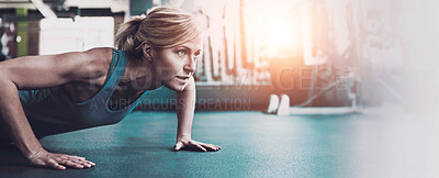 Buy stock photo Shot of a sporty woman working out at the gym