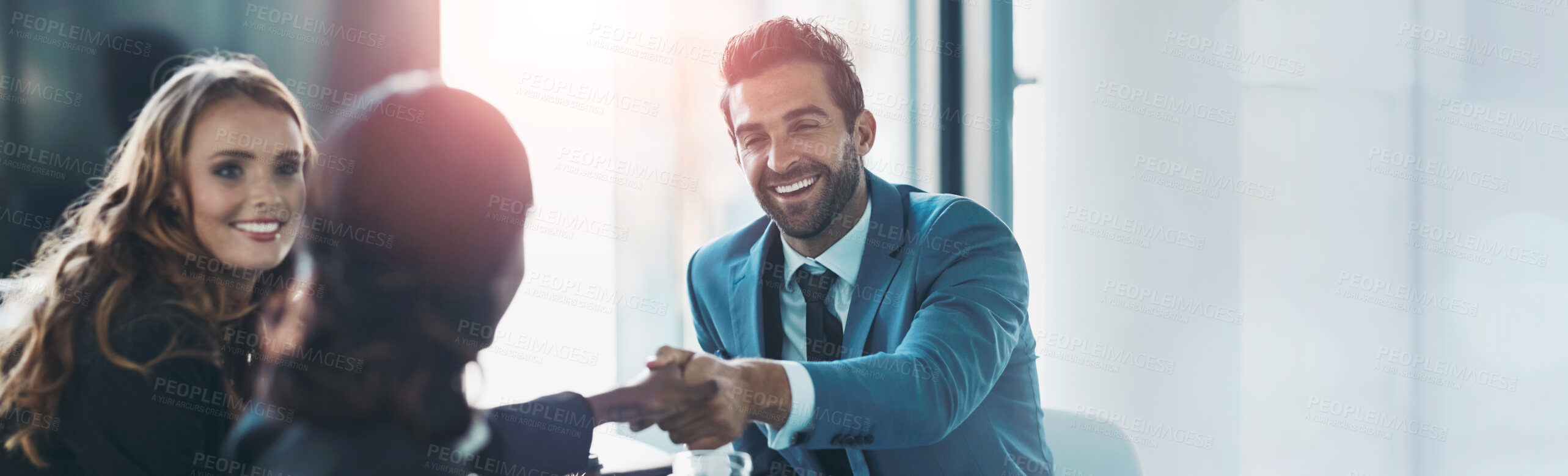 Buy stock photo Cropped shot of businesspeople shaking hands during a meeting in an office