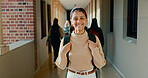 Smile, hallway and portrait of student at school with backpack for learning, studying or knowledge. Happy, teenager and girl from Mexico in corridor of academy for education class with scholarship.