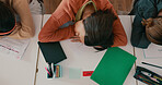 Exhausted, sleeping and girl on desk in classroom at school with fatigue in lesson for learning. Burnout, rest and teenager student with nap for tired with education, learning or studying for exam.