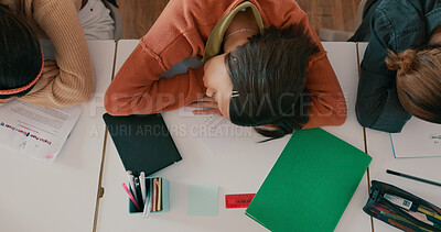 Buy stock photo Exhausted, sleeping and girl on desk in classroom at school with fatigue in lesson at academy. Burnout, above and teenager student with nap for tired with education, learning or studying for exam.