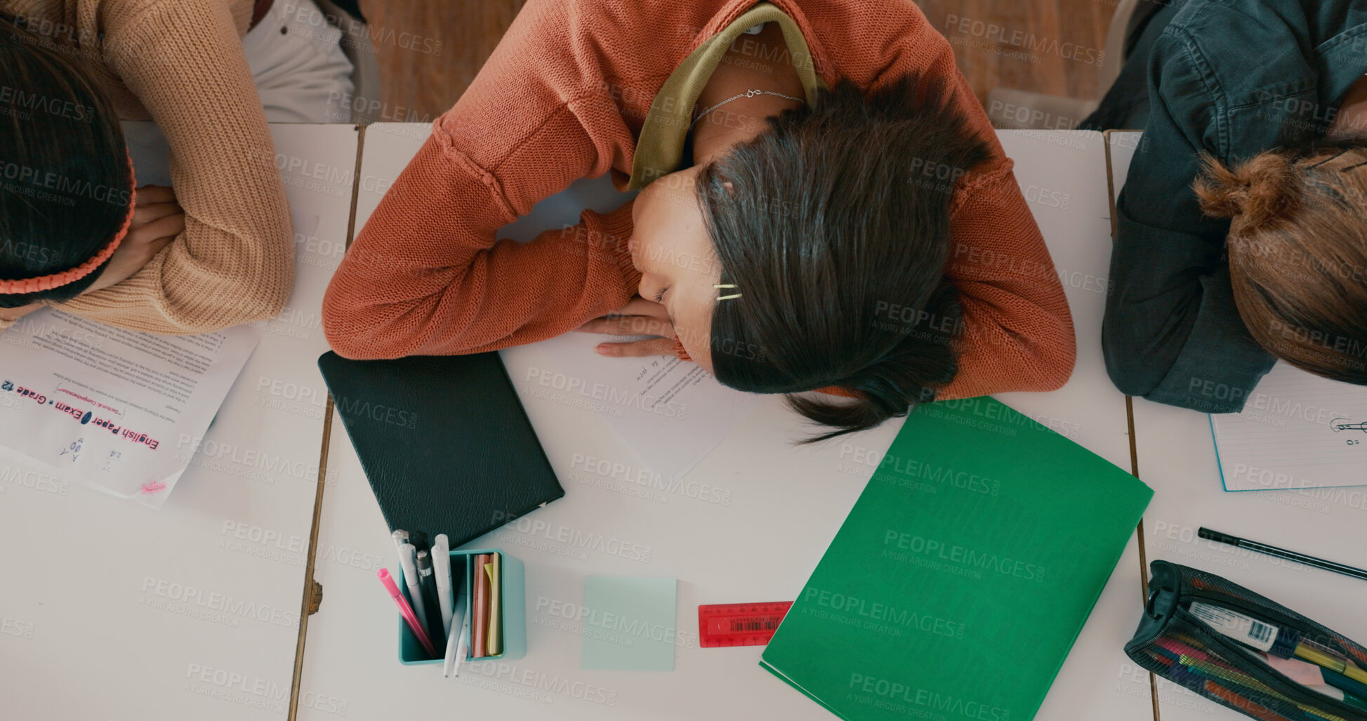 Buy stock photo Exhausted, sleeping and girl on desk in classroom at school with fatigue in lesson at academy. Burnout, above and teenager student with nap for tired with education, learning or studying for exam.