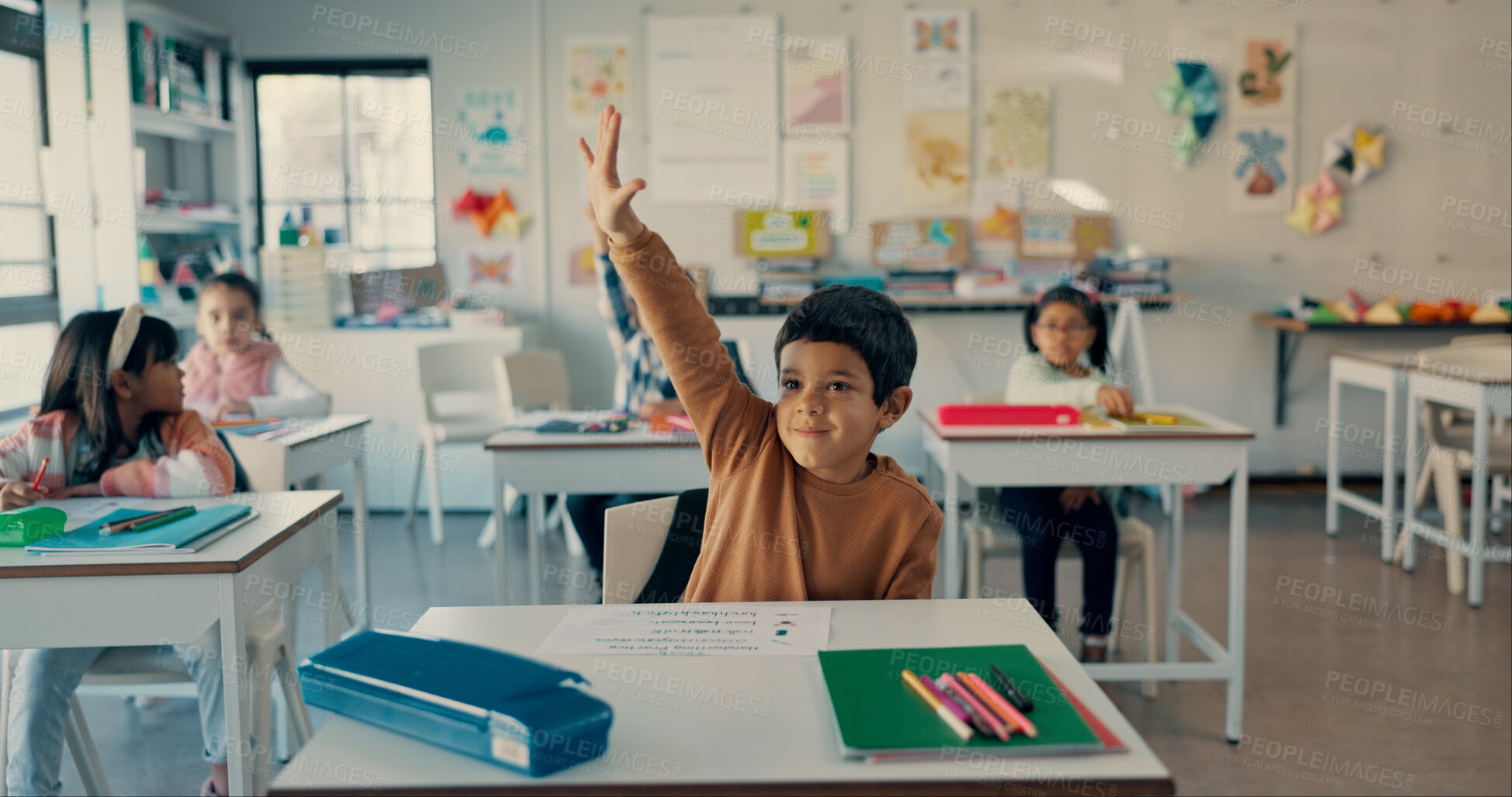 Buy stock photo Boy, child and happy with raised hand at school for question, answer and smile with solution for quiz. Kids, sign and group for problem solving, learning and assessment for education in classroom