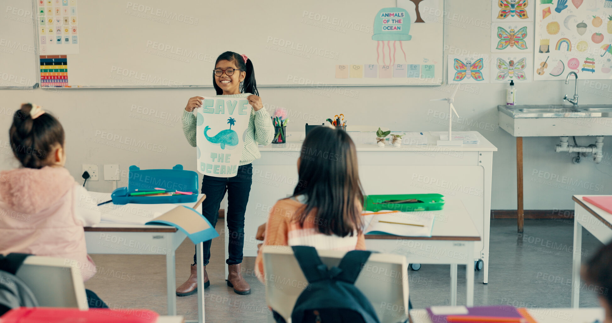 Buy stock photo Happy girl, classroom and presentation with poster for global warming, ocean conservation or awareness at school. Young kid, child or elementary student with sign or page to save eco friendly planet