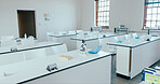 Empty, science classroom or school for education with biology room, medical research or learning practical. Medicine, equipment or interior of chemistry laboratory for study, scholarship or knowledge