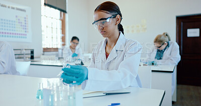 Buy stock photo Woman, student and scientist with dropper for experiment, chemical compound or exam in classroom. Young, female person or biologist with pipette or vials for sample, assessment or test in laboratory