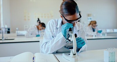 Buy stock photo Science, student and analysis with microscope in classroom for sample study, practical lesson and education. High school girl, notes and learning of medical research for experiment with ppe safety