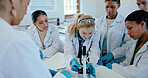 Students, girl and microscope in science lab for chemistry analysis, sample study or practical lesson. High school, people and learning of medical research for experiment with ppe safety in classroom