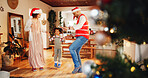 Christmas, dance and happy with family holding hands for festive magic, Noel cheer and xmas celebration. Love, winter holiday and decorations with people at home for present, vacation or excited