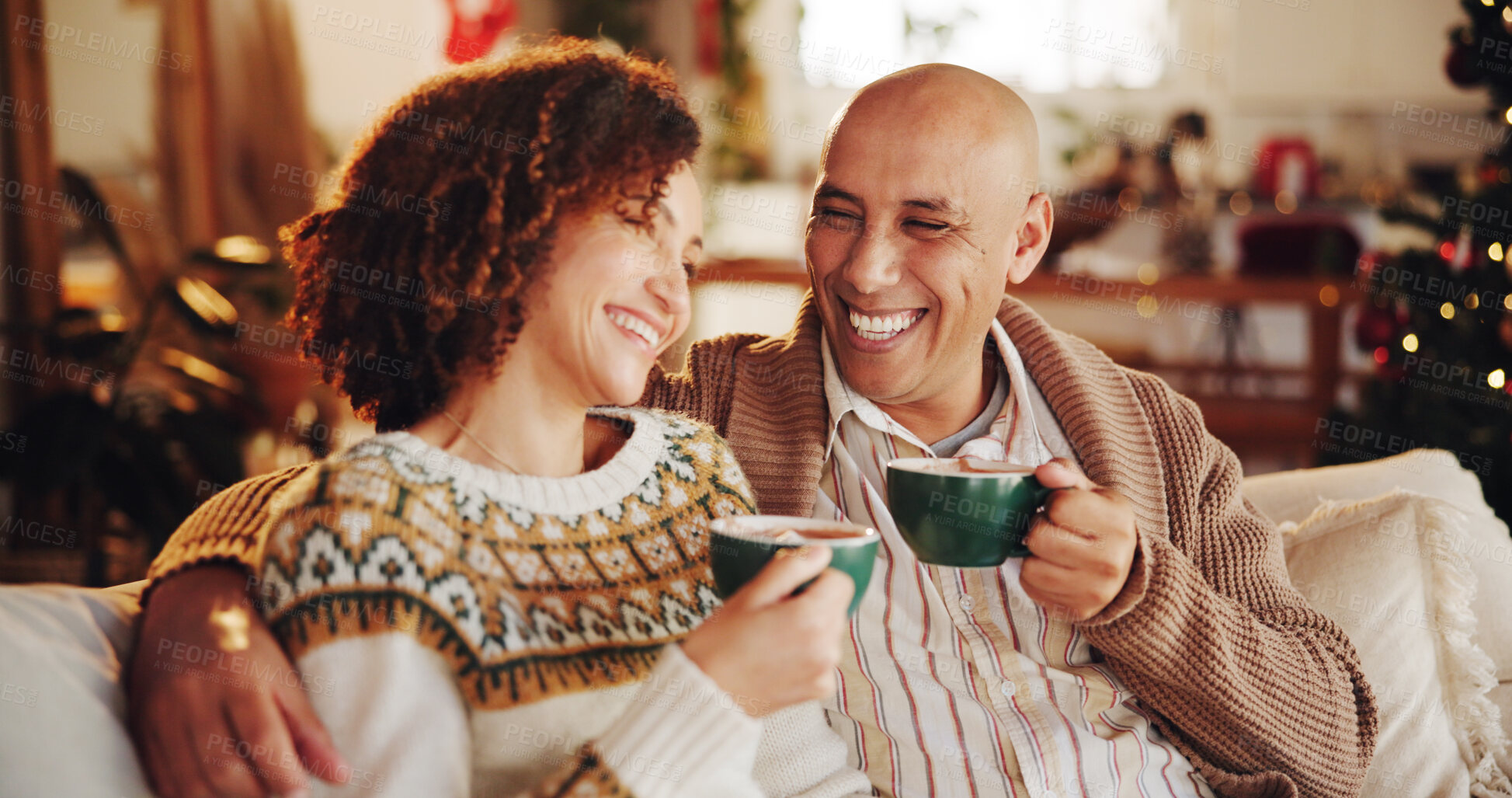 Buy stock photo Christmas, coffee and couple in home on sofa for holiday, vacation and festive season. Love, marriage and man and woman with hot chocolate drink for celebration, party and tradition in living room