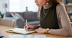 Business, hands and woman writing in house with financial statistics for company risk management. Remote work, data analyst and research notes for problem solving, budget strategy and finance report