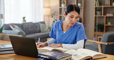 Buy stock photo Nurse, woman and studying with books by laptop for medical research, information and knowledge. Healthcare, worker and reading with technology at desk for diagnosis reference, guide or treatment plan