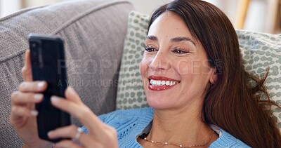 Buy stock photo Woman, phone and relax on couch in home with social media post, streaming subscription and online videos. Person, happy and smartphone on sofa for reading ebook, dating site or browsing internet blog