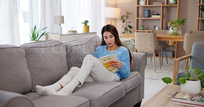 Buy stock photo Woman, reading and book on couch in home for story, fiction tale and literature hobby to relax. Person, fantasy novel or learning information on sofa in lounge for education, knowledge or comfortable