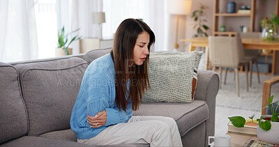 Buy stock photo Sick woman, stomach pain and stress on sofa with endometriosis, menstruation ache or pelvic inflammatory disease. Person, ill or uncomfortable tummy cramps with constipation or gastric crisis in home