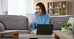 Documents, reading and woman on laptop in home with paperwork for online banking, finance and taxes. Remote work, bookkeeping or female person with report for debt payment, financial review and bills