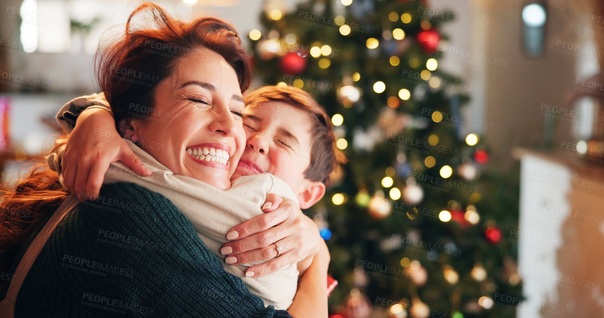 Buy stock photo Christmas, house and hug with mama, son and bonding together with love, decoration and mother in lounge. Xmas tree, family and parent with boy, embrace and care with happiness, holiday and festive