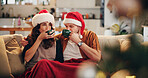 Couple, coffee and sofa in home for Christmas, celebration and bonding together with holiday and hug. Woman, man and mature people in living room for relax, support and vacation with embrace in house