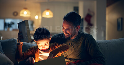 Buy stock photo Gift, happy and child with father in home opening surprise for birthday celebration at night. Excited, light and boy kid on sofa with dad for present box for event together in living room at house.