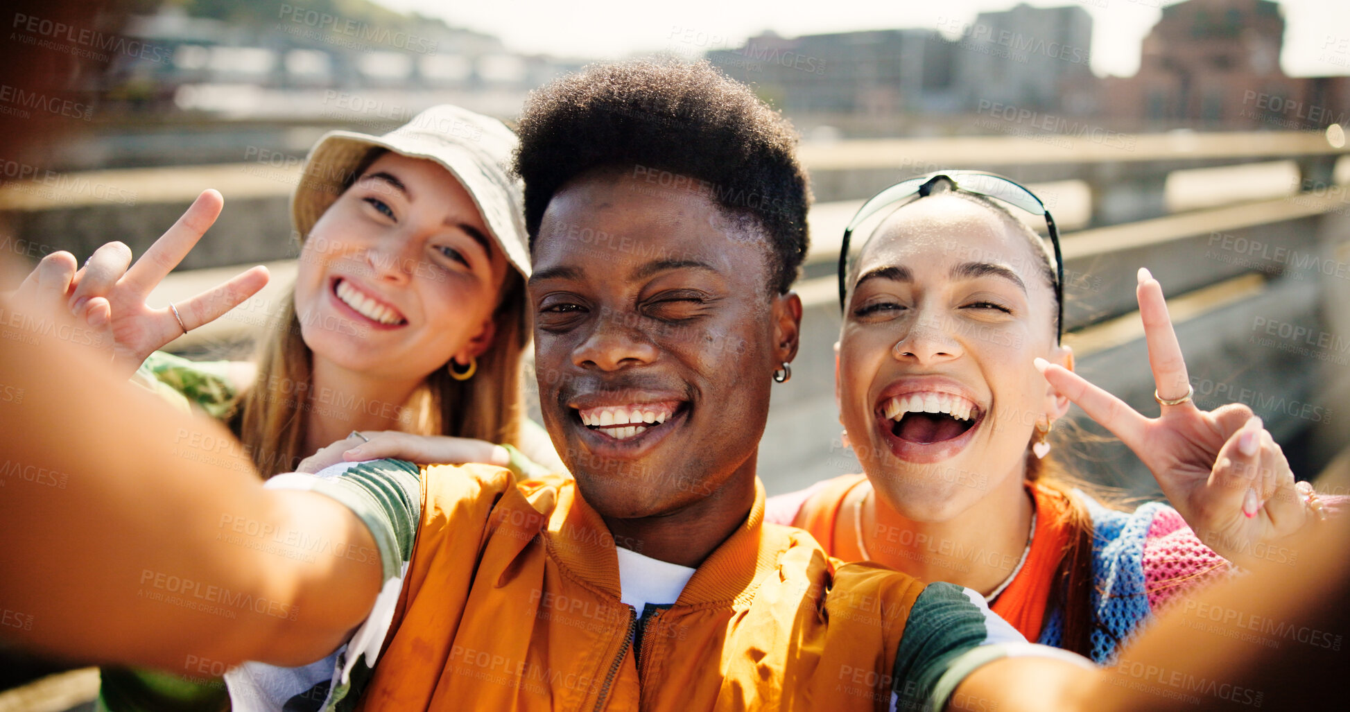 Buy stock photo City, portrait and friends with peace for selfie, summer memory and profile picture for social media. Urban bridge, women and man with photography for gen z fashion, funny joke and bonding outdoor