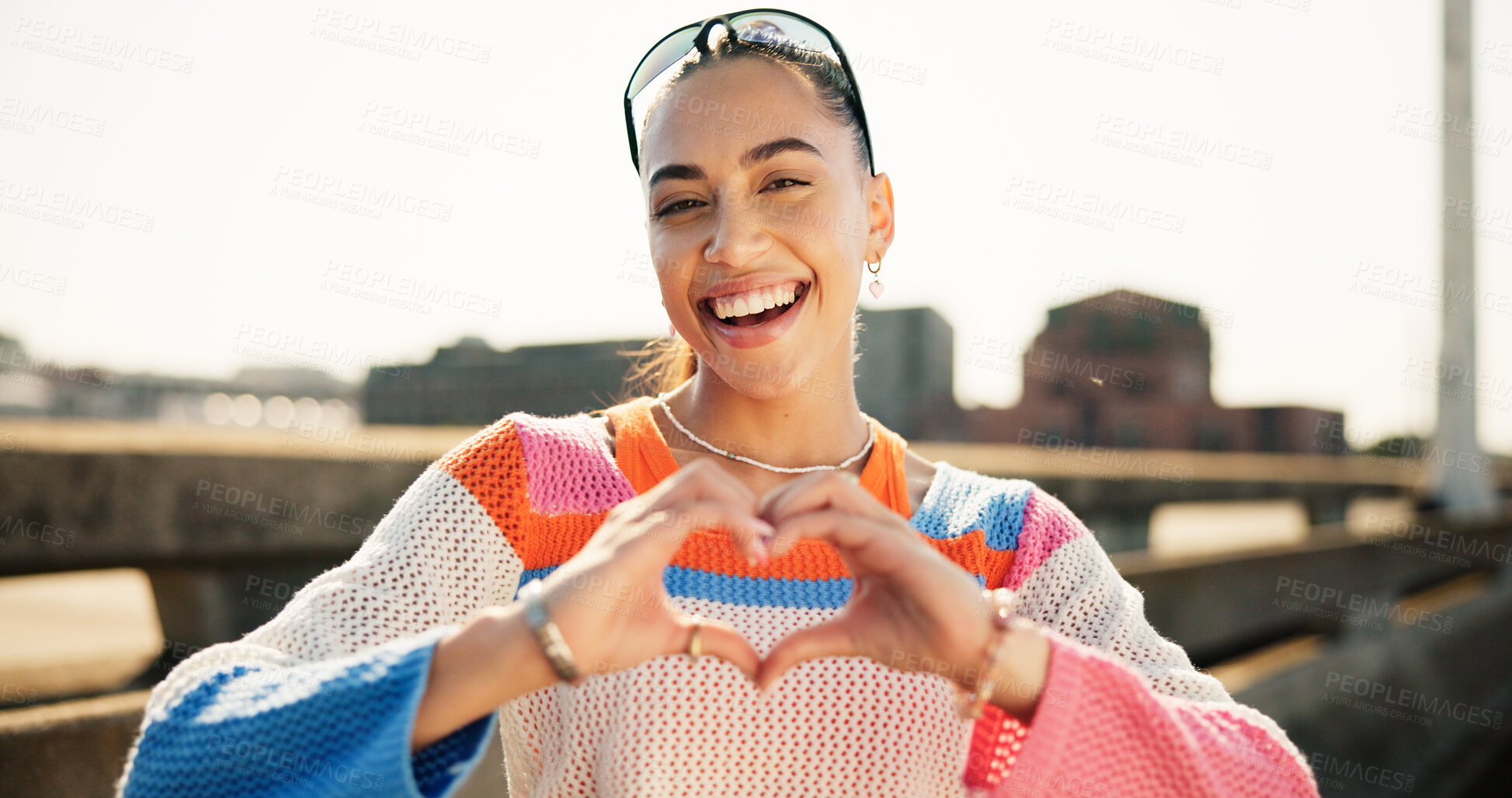 Buy stock photo City, portrait and woman with hands for heart, gratitude and affection with confidence for expression. Bridge, female person and happiness with love reaction for fashion, emoji symbol and positive