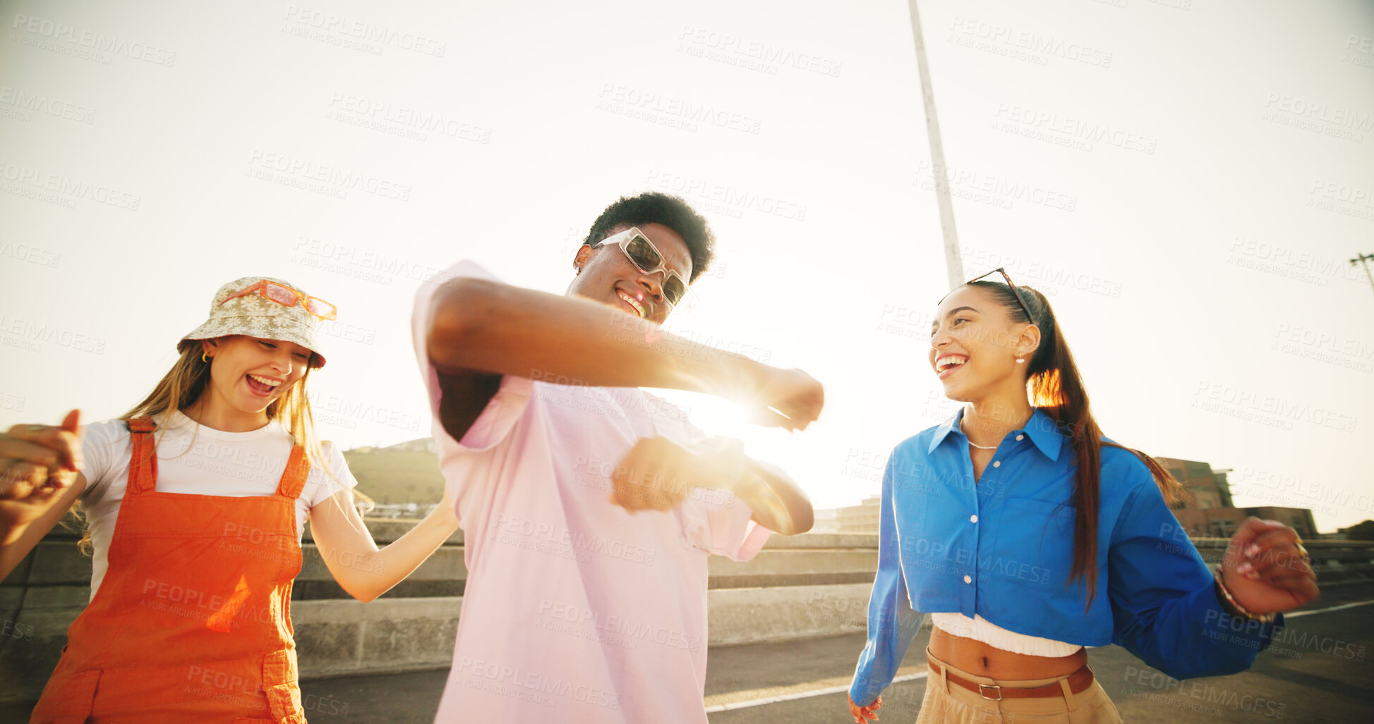 Buy stock photo City, smile and group of happy people with dance, diversity and cool streetwear style at sunset. Excited, fun and gen z friends with urban fashion, positive energy and bonding in street together.