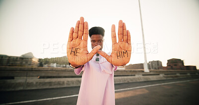 Buy stock photo Hands, pronouns and person with he, him and outdoor for gender identity, inclusion or sexuality with opinion in street. Portrait, equality and palm with writing, voice or sign for announcement in USA