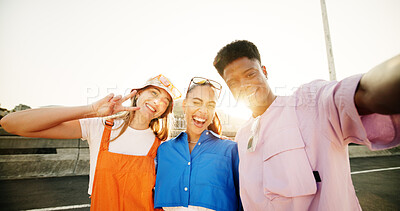 Buy stock photo City, style and group of people with selfie, diversity and cool streetwear on bridge at sunset. Confidence, pride and gen z friends with urban fashion, culture and bonding in street portrait together