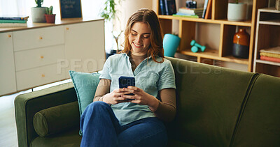 Buy stock photo Smile, woman and relax with phone on couch for communication, social media and notification update. Happy, girl and mobile for reading message, online chat and texting of entertainment game at house