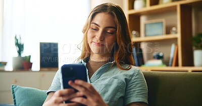 Buy stock photo Happy, girl and relax with phone on couch for communication, social media and notification update. Smile, woman and mobile for reading message, online chat and texting of entertainment game at house