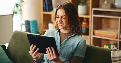 Buy stock photo Tablet, smile and woman on sofa with streaming, search or watching video website in living room. Social media, relax and happy girl on couch with digital app, virtual connection or fun meme in home