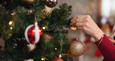 Buy stock photo Christmas, hand and tree with person and bauble for decoration, gift giving and festive season. Xmas, holiday and celebration with closeup in living room at home for tradition, noel and winter