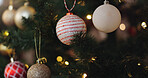 Ornaments, tree and decoration for Christmas, home and tradition for festive, color and sparkle of lights. Creative, holiday and season of celebration, event and detail on ball,  shiny and apartment
