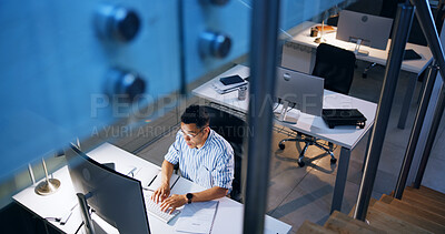 Buy stock photo Business, above and man with computer, typing and internet with research for project, night or screenplay. Person, employee or consultant in modern office, website info or film production with writer