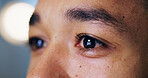 Eyes, person and reading in closeup, office and night for review, overtime and reflection by computer. Writer, editor or media consultant with thinking, inspiration or insight at creative agency