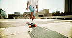 City, feet and skateboard with shadow of person outdoor for hobby, leisure or sports in summer. Balance, fitness and transport with legs of skater in urban town for exercise, motion or performance
